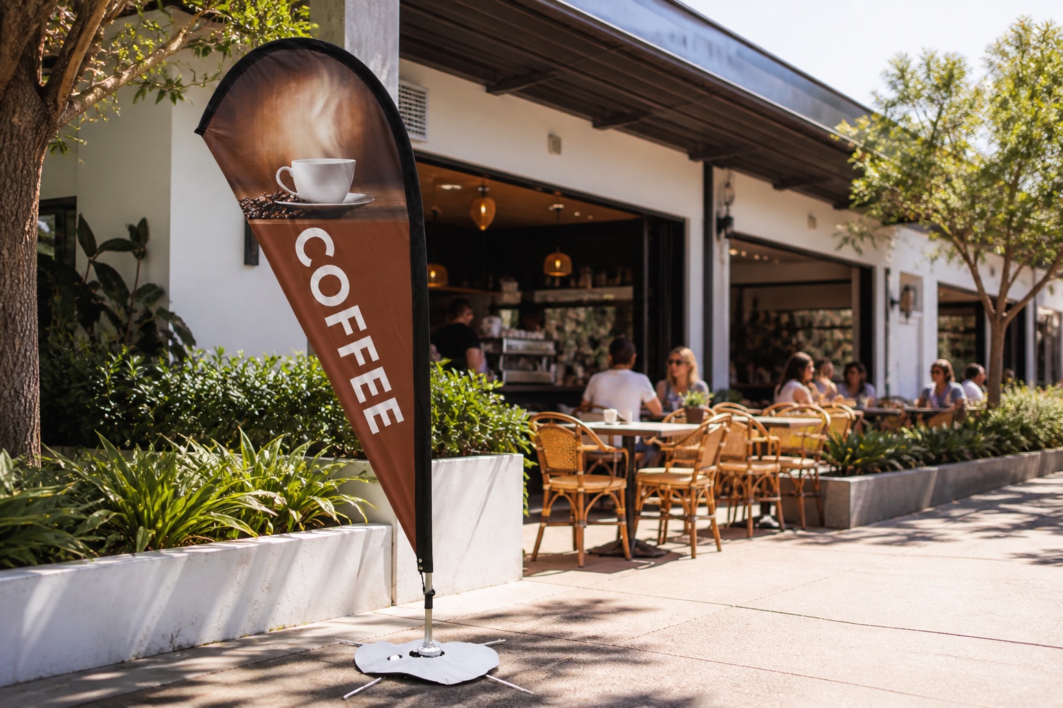 Brown Coffee teardrop flag outside a café